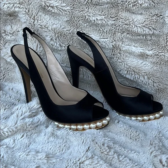 Nicholas Kirkwood black sling-back heals with signature pearl platform.
